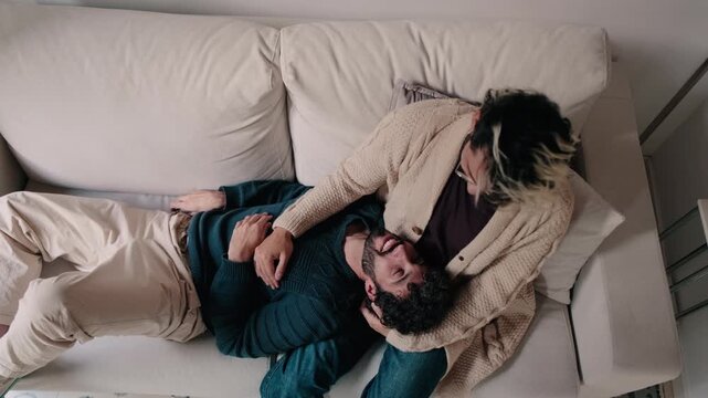 Gay Couple Relaxing Together At Home