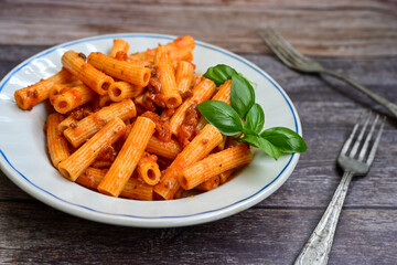  Pasta bolognese .Italian home made meal Fresh   maccheroni pasta with tomato sauce, basil, herbs ,parmesan cheese ,fresh cherry tomatoes and parsley on wooden background. Kitchen Poster 