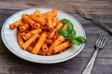  Pasta bolognese .Italian home made meal Fresh   maccheroni pasta with tomato sauce, basil, herbs ,parmesan cheese ,fresh cherry tomatoes and parsley on wooden background. Kitchen Poster 