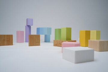Obraz premium Pastel wooden blocks arranged on a white surface creating an abstract composition scene