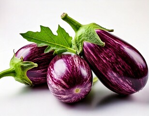 Fresh graffiti eggplants display beautiful purple stripes and vibrant green leaves against a.jpg