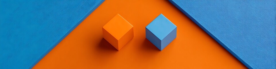Orange and blue contrasting flatlay of adapters on angular surfaces
