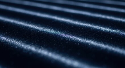 Close up of dark blue textured fabric with diagonal light reflections