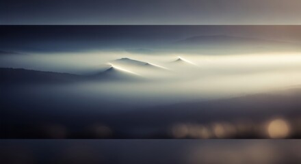Misty mountain peaks emerging from a foggy landscape