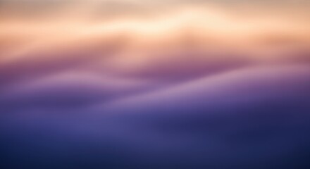 Abstract blurry sunset sky with purple and orange hues
