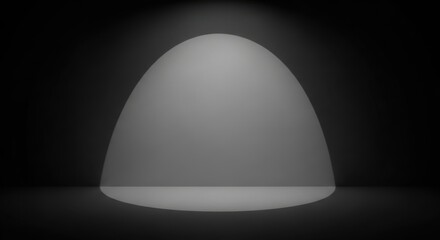 Spotlight illuminates an empty stage in darkness