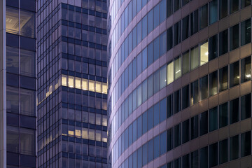 Blue hour night atmosphere shaping corporate architecture with reflection on office windows and a modern design urban facade suited to high-end branding solutions