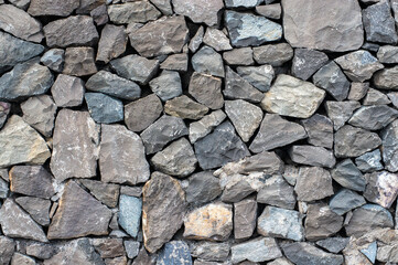 Stone wall, texture of rubble stone