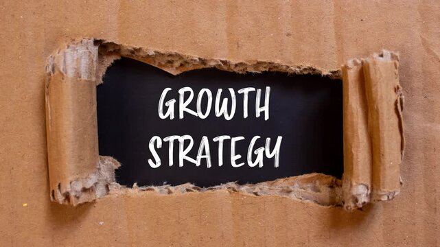 Growth Strategy message writing on ripped torn paper background