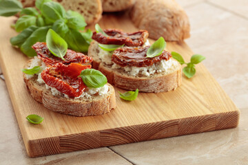 Ciabatta with sun dried tomatoes in olive oil, ricotta, and basil.