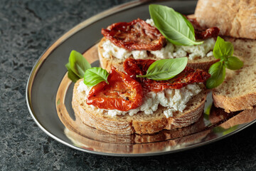 Ciabatta with sun dried tomatoes in olive oil, ricotta and basil.