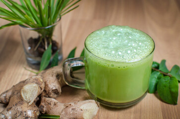 
Green Ginger Tea and Ginger Milk Tea in Glass Cups – Traditional Herbal Drink with Fresh Ginger, Healthy Beverage Concept
