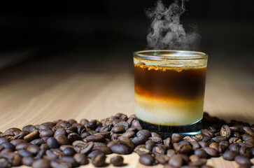 resh Roasted Coffee Beans with Espresso in Glass Cup on Wooden Table – Aromatic Coffee Concept with Natural Decor for Café, Beverage, and Food Photography