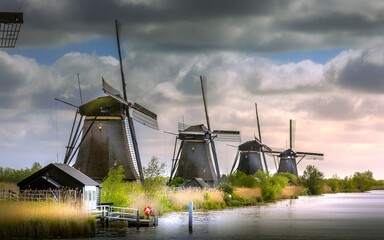 Kinderdijk, Netherlands - April 20, 2024: Kinderdijk, a village in the Netherlands, is famous for its iconic windmills built in the 18th century