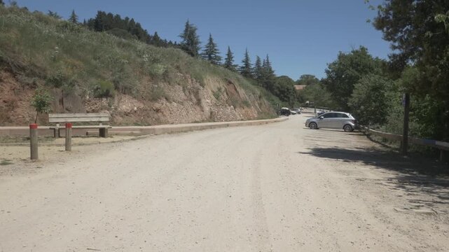 Coll Estenalles dirt road gimbal stabilized car parking Sant Llorenc