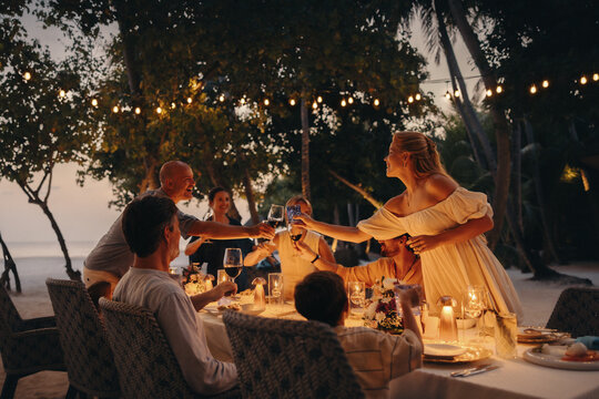 Family enjoying a tropical vacation dinner at a luxury resort