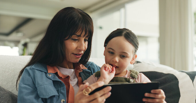 Tablet, happy and mother with child on sofa in home for watching series, movie or video on app. Relax, digital technology and girl kid with mom for streaming film online in living room at house.