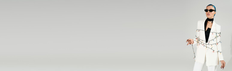 Winter wonderland vibes with a chic young woman glowing in festive lights