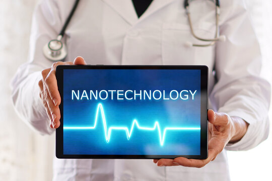 nanotechnology. Female doctor with the word written on a digital tablet