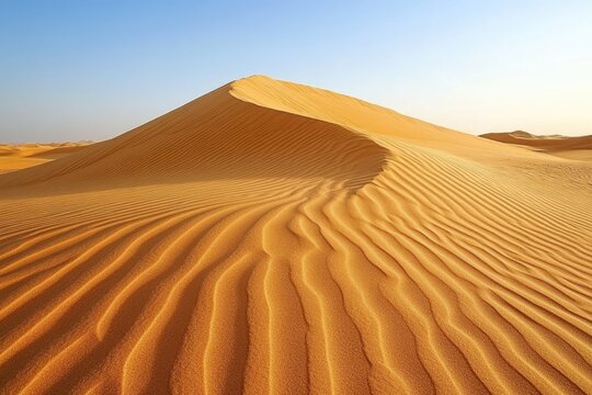 Majestic golden sand dunes with intricate wind-blown ripples under a clear blue sky, evoking a sense of serene desert vastness. - Powered by Adobe