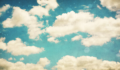 Vintage background in the blue sky with clouds