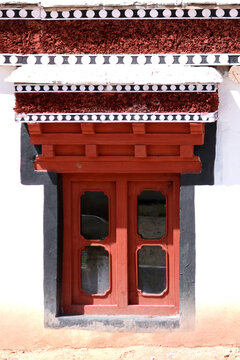 This image shows a beautiful wooden window at the Hemis Monastery, a Tibetan Buddhist monastery of the Drukpa Lineage in Hemis, Ladakh, India. 