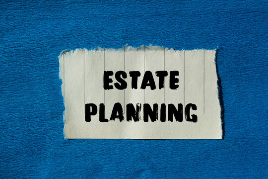 Estate planning message written on ripped torn paper background. Conceptual Estate planning symbol. Copy space.