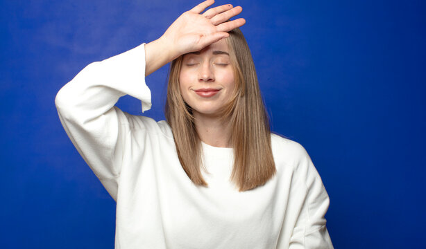 looking stressed, tired and frustrated, drying sweat off forehead, feeling hopeless and exhausted