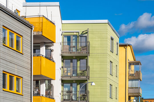 Clean-lined architecture and bright housing geometry shaping an urban corridor in contemporary sweden, stockholm, stora ursvik delivering sharp residential facade contrast
