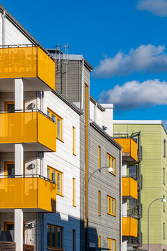 Modern block architecture and patterned housing units enhancing an urban profile of contemporary sweden, stockholm, stora ursvik through vivid residential facade contrast