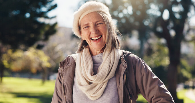 Fashion, laughing and portrait of old woman in park for break, retirement or winter wellness. Clothes, outfit and style with funny senior person outdoor in nature for cold morning or satisfaction