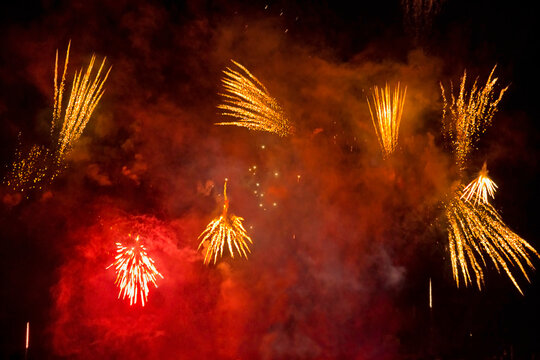 Close-up of fireworks with red and yellow lights - Powered by Adobe