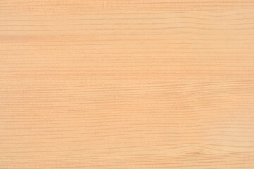 A close-up, full-frame view captures the smooth, pale pine wood surface with fine, horizontal grain lines and no knots