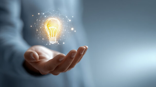 Person holding glowing light bulb symbolizing creativity and innovative ideas in technology with futuristic digital network connection effects - Powered by Adobe
