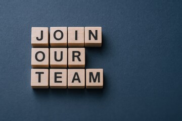 Join Our Team: Wooden Blocks Spelling Recruitment Message on Blue Background for Hiring Campaign