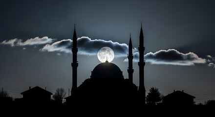 Silhouette of a mosque dome and minarets against a dramatic full moon and cloudy night sky