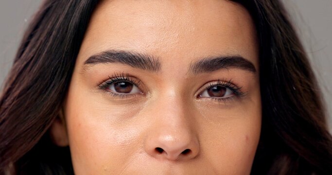 Portrait, woman and eyes in studio with eyelash extension, microblading and skincare for beauty. Female person, lash lift and eyebrow transformation for makeup aesthetic, wellness and dermatology.