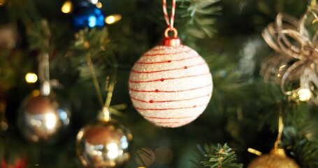 Christmas, festive and wallpaper with bauble on tree in home for celebration, event or tradition....