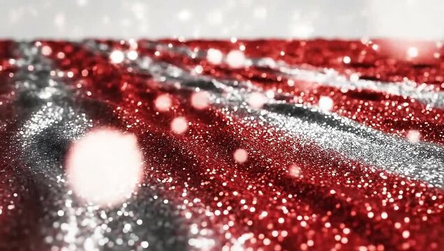 Red and silver glitter waves with bokeh lights and falling particles, festive background.