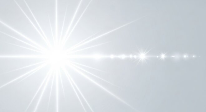 A bright white starburst with a horizontal lens flare effect on a light gray background.