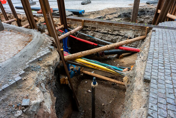 Trench excavated for urban utility pipe repair.