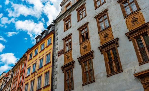 Colorful historic buildings line Prague street.