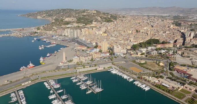 Aerial view of the city and port of Licata, a small town in the province of Agrigento, Sicily, Italy. The city overlooks the Mediterranean Sea.
