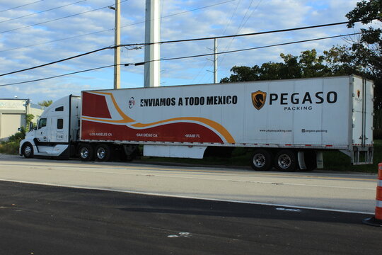 Pegaso Packaging tractor trailer on side of road