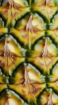 Bright and colorful close-up of a pineapple texture showing unique patterns and shades of yellow and green