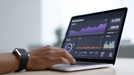 Focused business professional analyzing financial data and stock market charts on laptop. screen shows dashboard with graphs for business intelligence and analytics