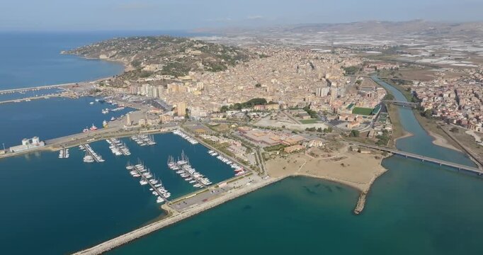 Aerial view of the city of Licata, a small town in the province of Agrigento, Sicily, Italy. The city, built near a canal, overlooks the Mediterranean Sea.