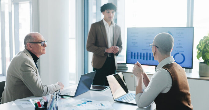 Presentation, screen or businessman in office with pitch, statistics review or plan for b2b strategy. Talking, person or proposal with tech for profit generation idea, financial investment or graphs.