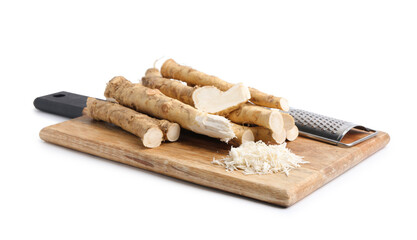 Grated horseradish, grater and roots isolated on white