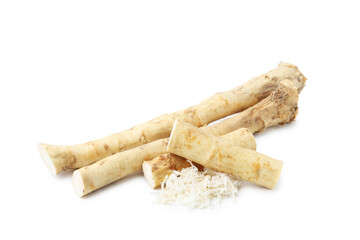 Grated horseradish and roots isolated on white